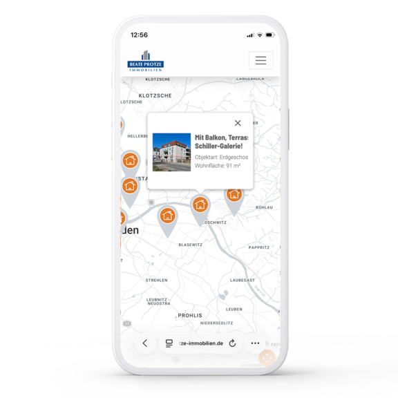 Smartphone mit einer Immobilien-Karte mit geöffnetem Modal einer Immobilie.