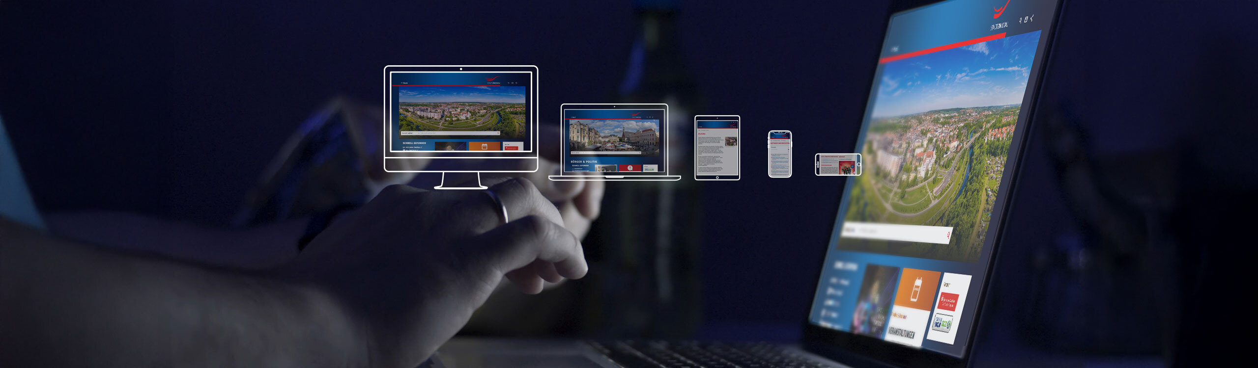 Grafik: Person bedient Laptop mit Zwickau Website