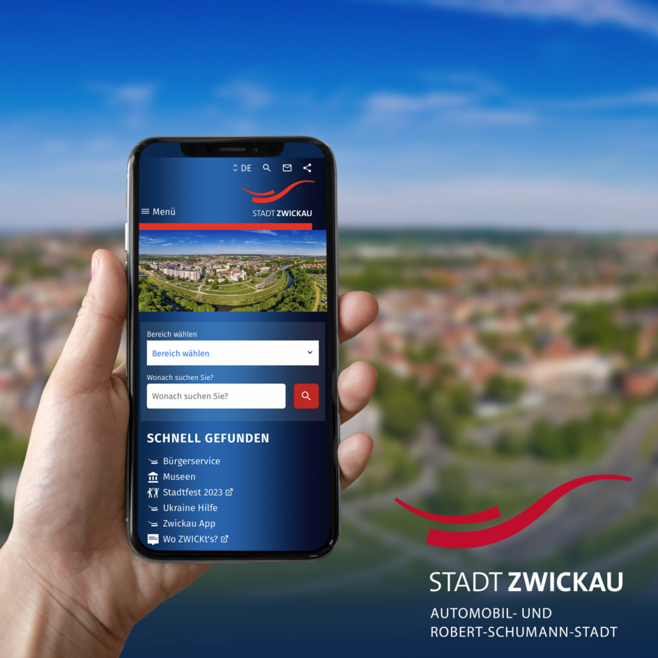 Grafik: Person hält Handy mit Zwickau Website