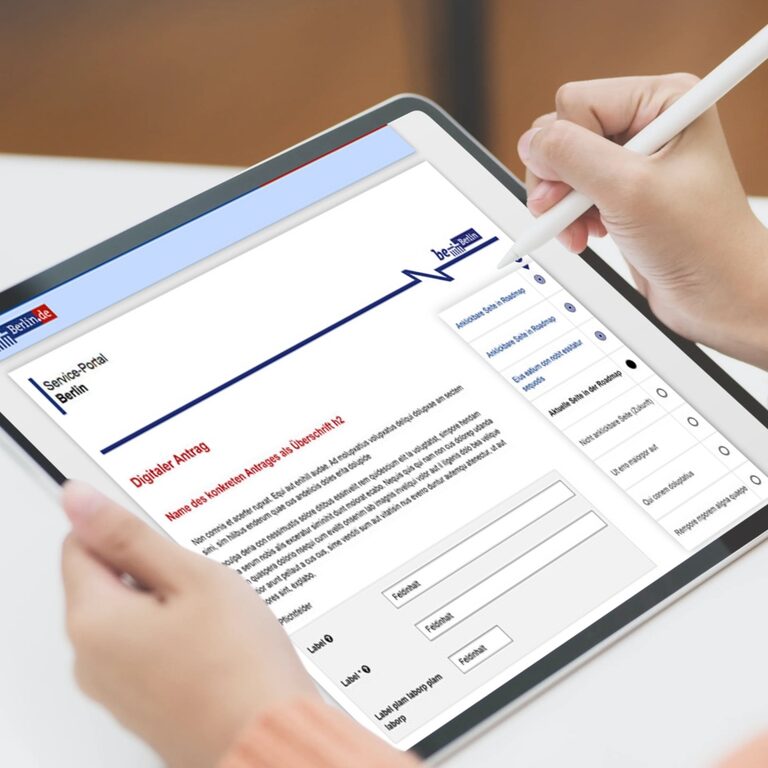 Formular-bda4.jpg Foto: Hände bedienen Tablet mit Formular.